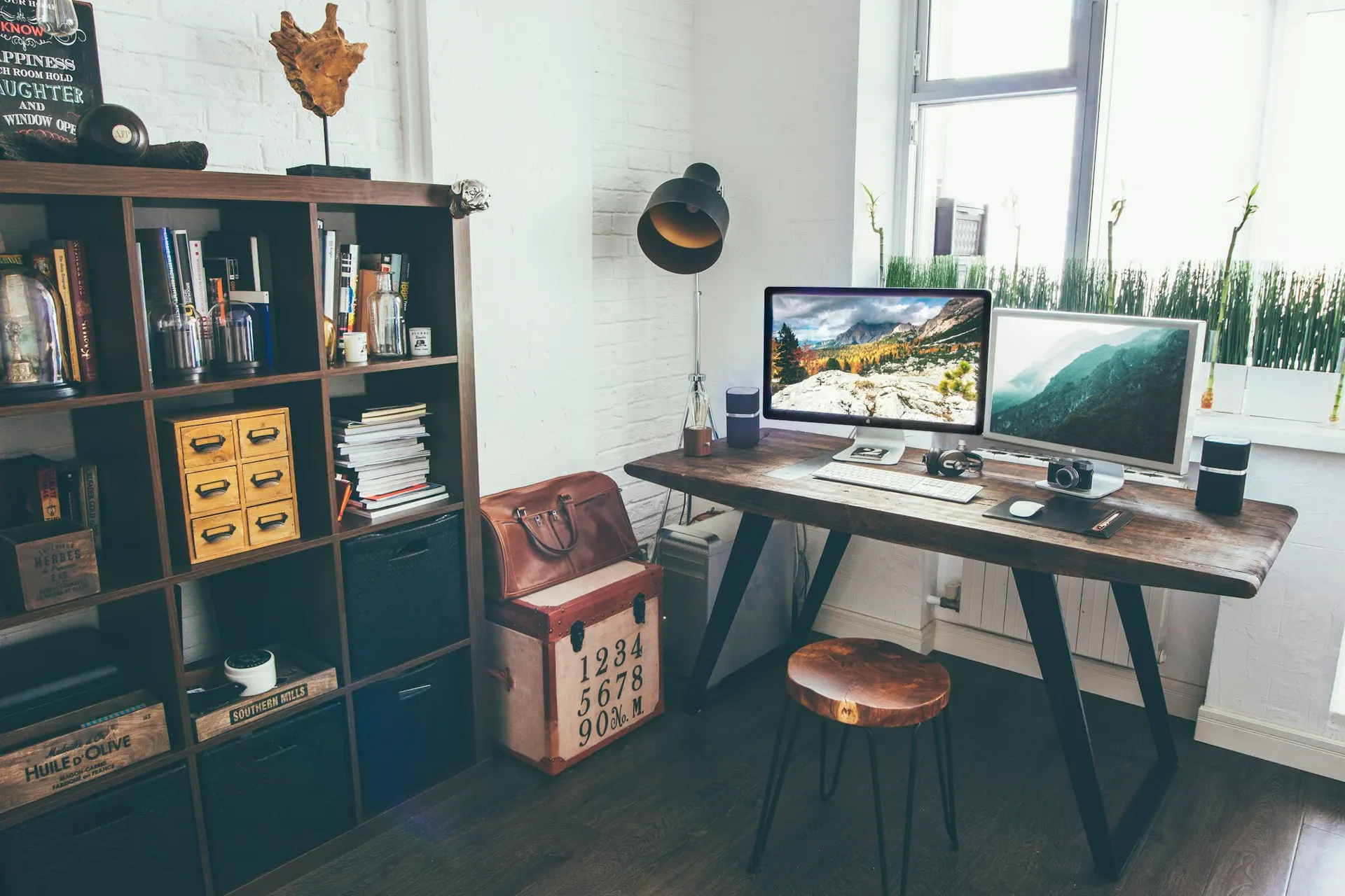 Multiple computer monitors arranged on a workspace desk, representing display hardware categories.