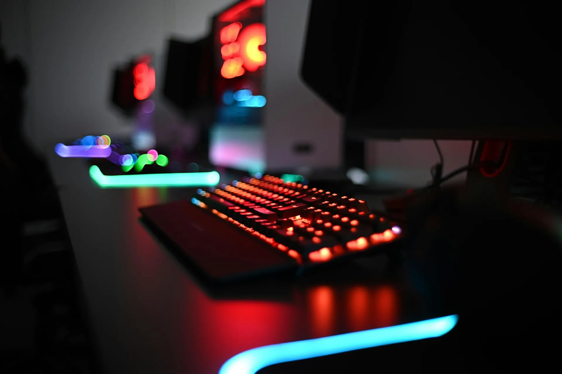 Computer peripherals including a keyboard and mouse arranged on a desk.
