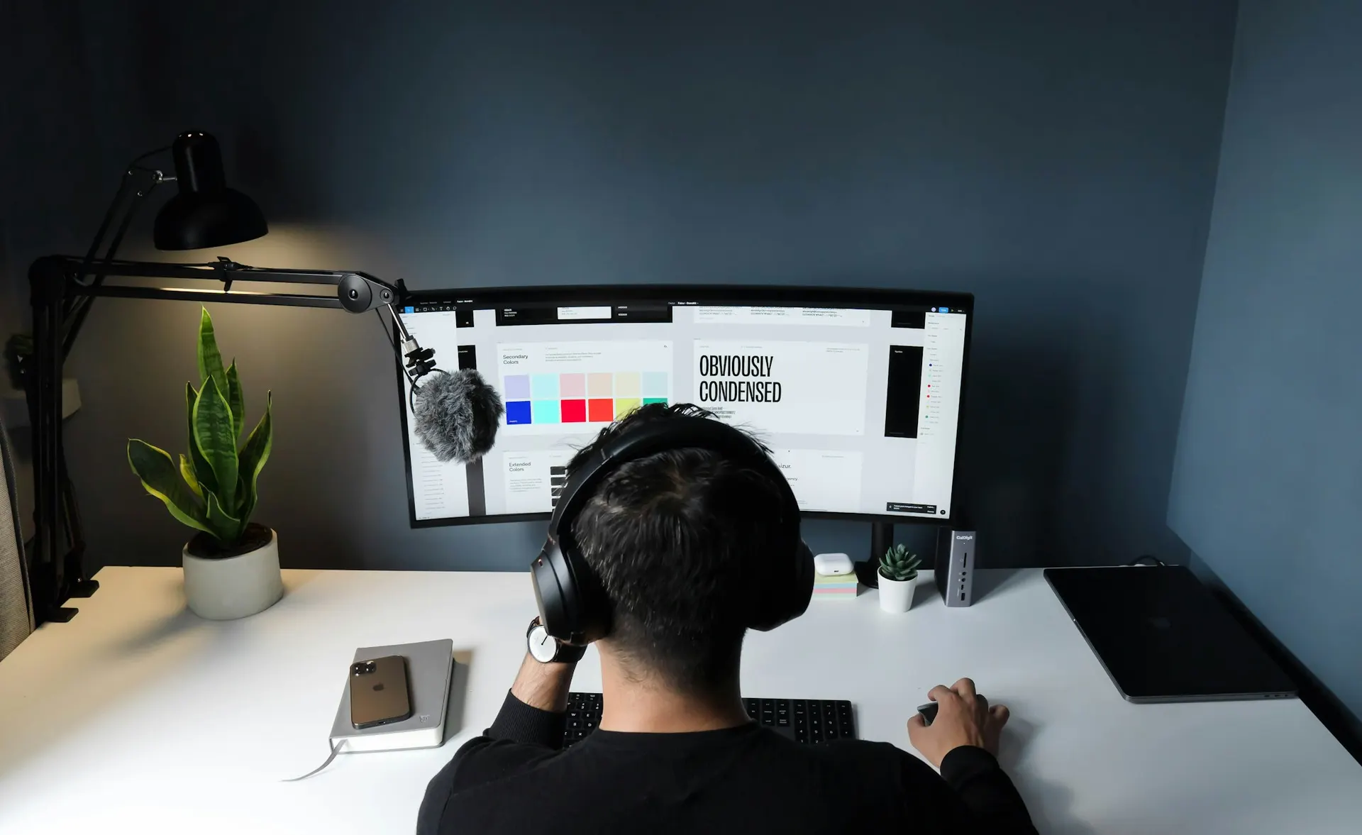 A remote working desk equipped with a laptop and monitor setup.